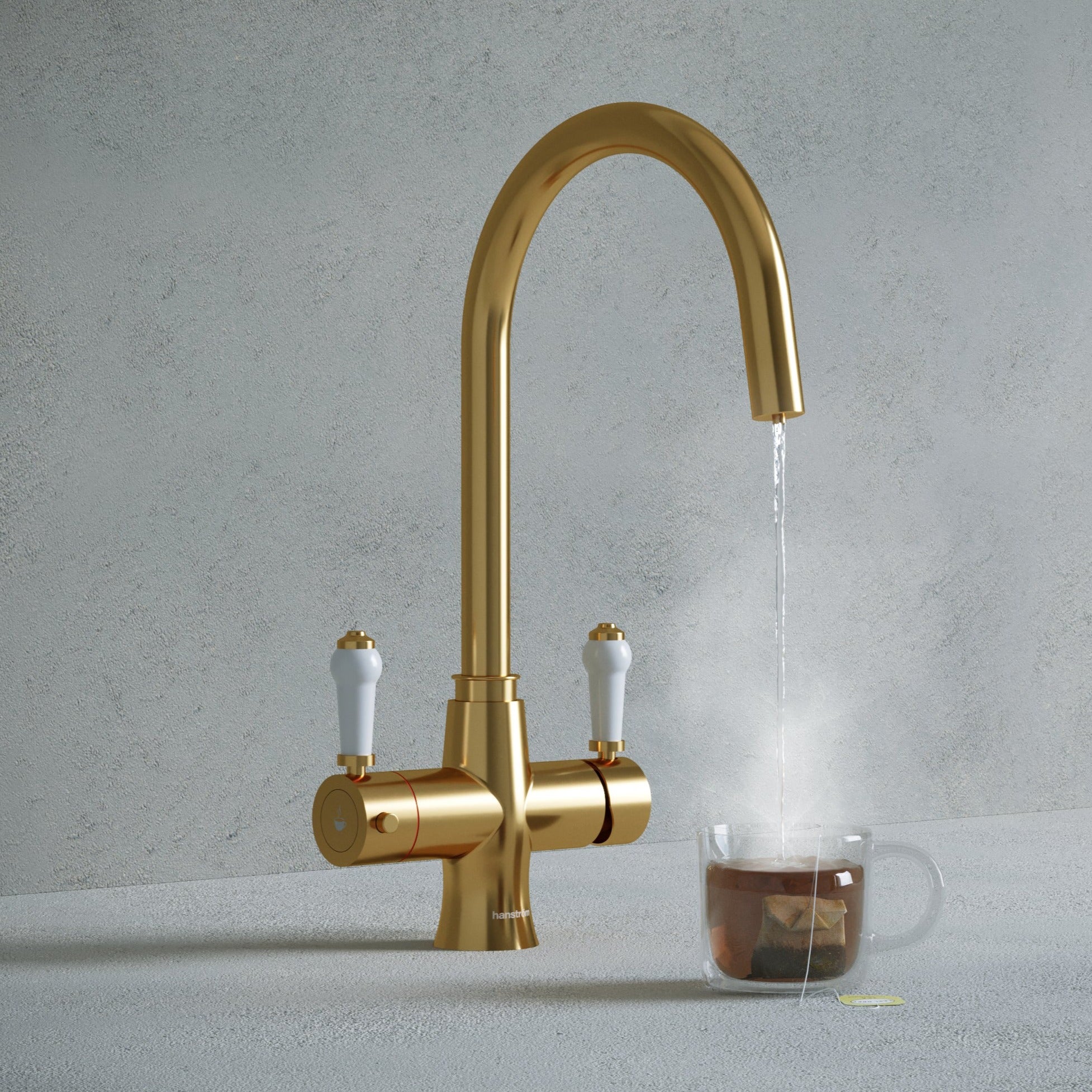 a traditional brushed gold swan neck kitchen hot tap with white handle