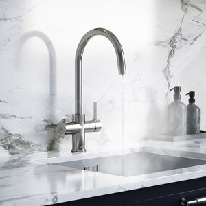 a chrome swan neck boiling water tap on a white kitchen countertop