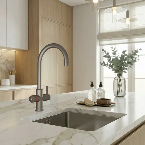 Modern kitchen with marble countertop, stainless steel sink, and wooden cabinets.
