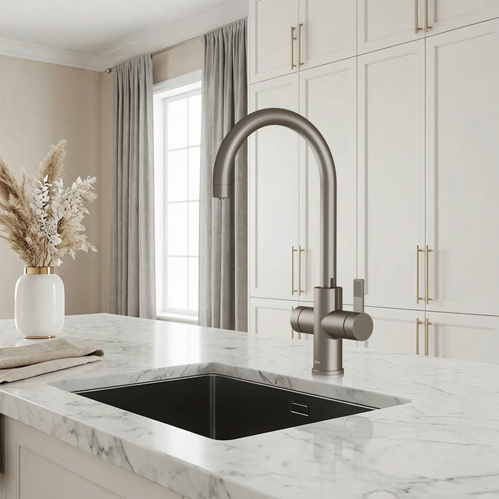Modern kitchen with a stainless steel faucet over a black sink, marble countertop, and light-colored cabinets.
