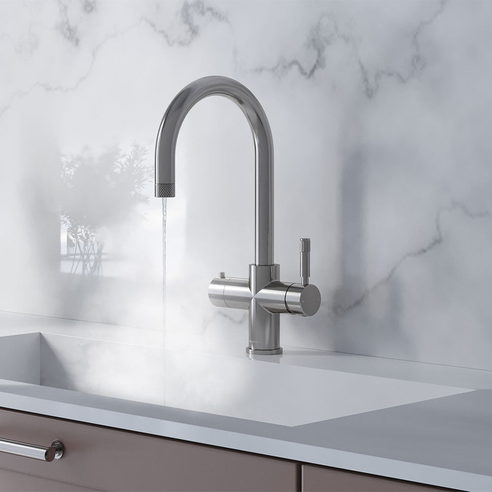 a chrome swan neck boiling water tap on a white kitchen countertop