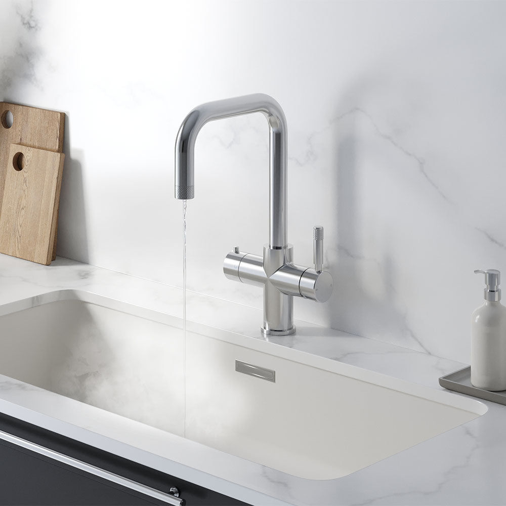 a square-shaped chrome boiling water tap on a white kitchen countertop
