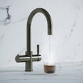 a gunmetal grey swan neck boiling water tap
