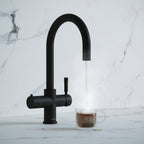 a matt black swan neck boiling water tap