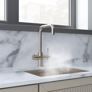 a brushed nickel copper boiling water tap on a white kitchen countertop