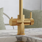 close-up of a brushed gold hot tap handle