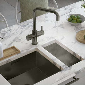 a square-shaped gunmetal grey boiling water tap on a white kitchen countertop