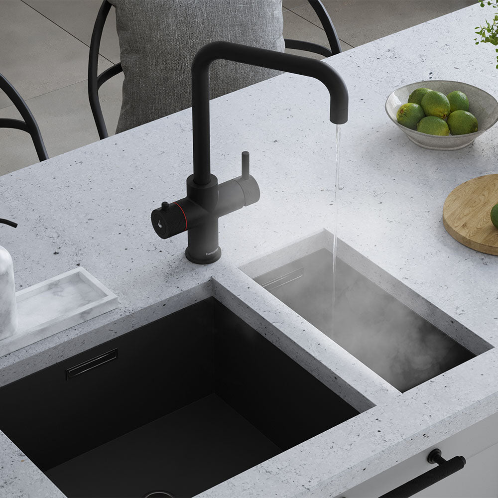 a matt black square-shaped boiling water tap on a white kitchen countertop