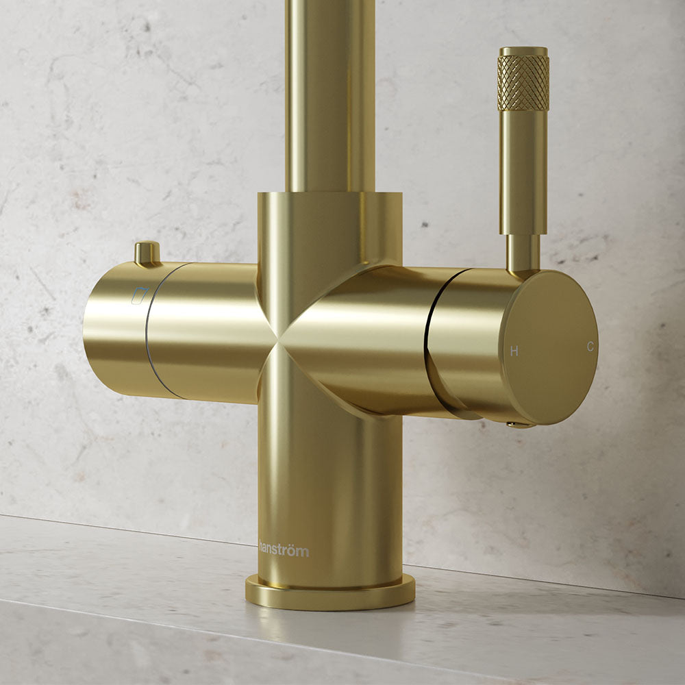 close-up of a champagne gold hot tap handle