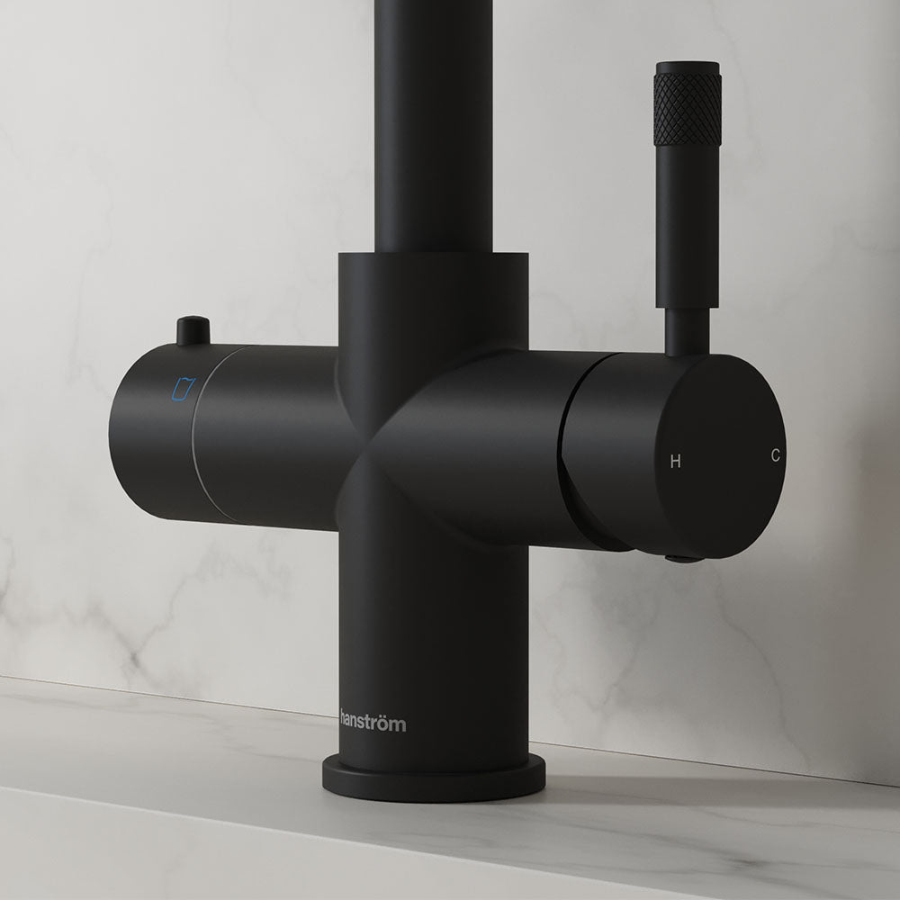 Close-up of a matt black hot tap handle