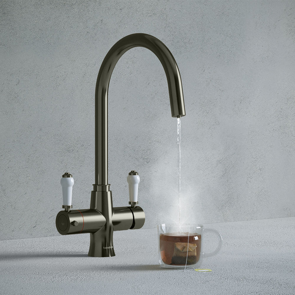 a traditional gunmetal grey swan neck kitchen hot tap with white handle
