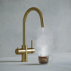 a brass swan neck boiling water tap