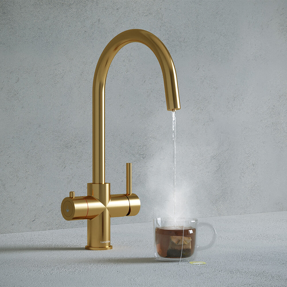 a gold swan neck boiling water tap