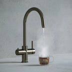 a gunmetal grey swan neck boiling water tap
