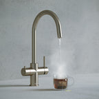 a brushed nickel swan neck boiling water tap