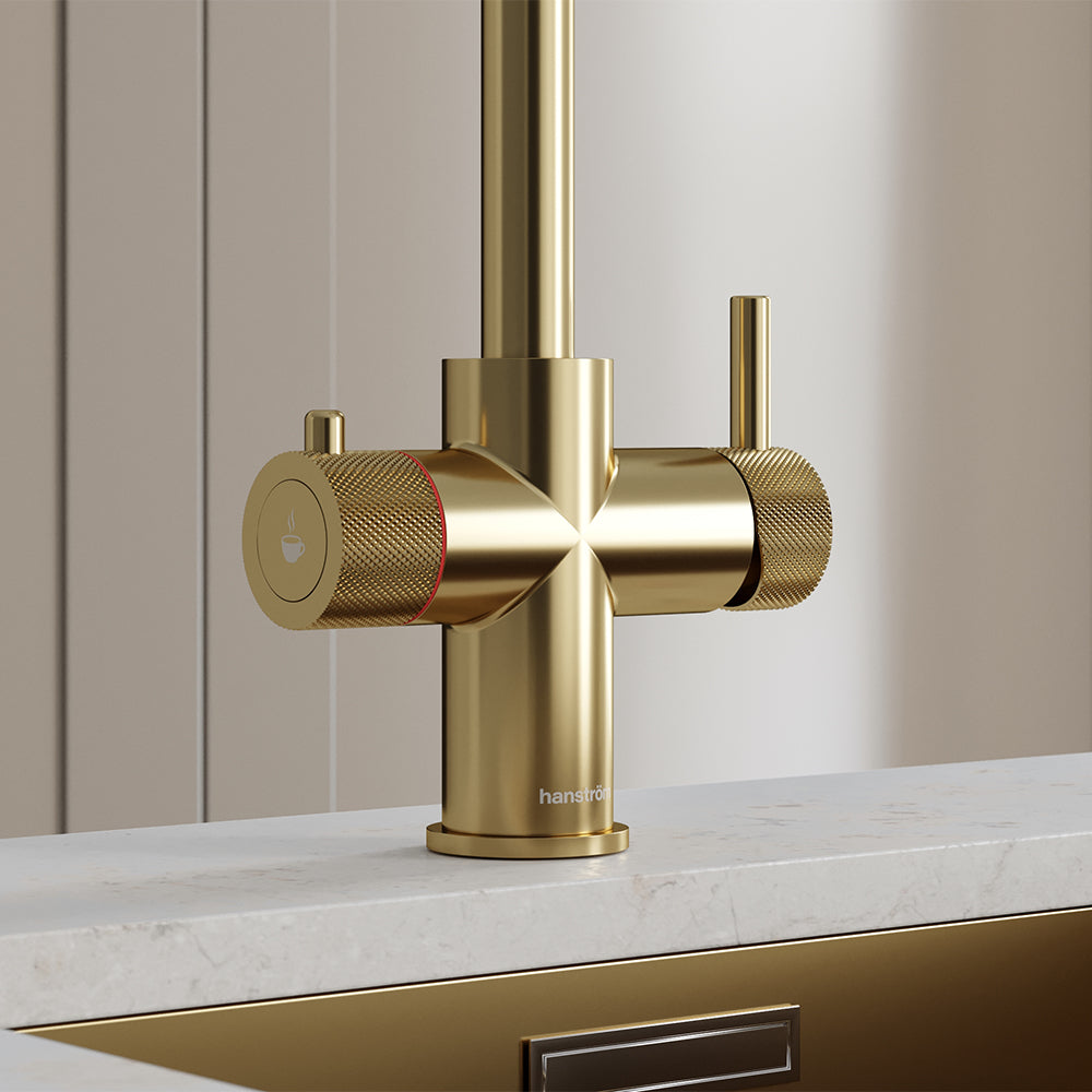 close-up of a brushed brass hot tap handle