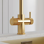 close-up of a brushed gold hot tap handle