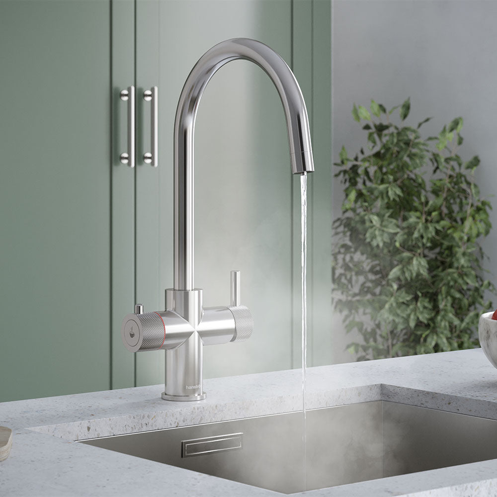a chrome\ swan neck boiling water tap on a kitchen countertop