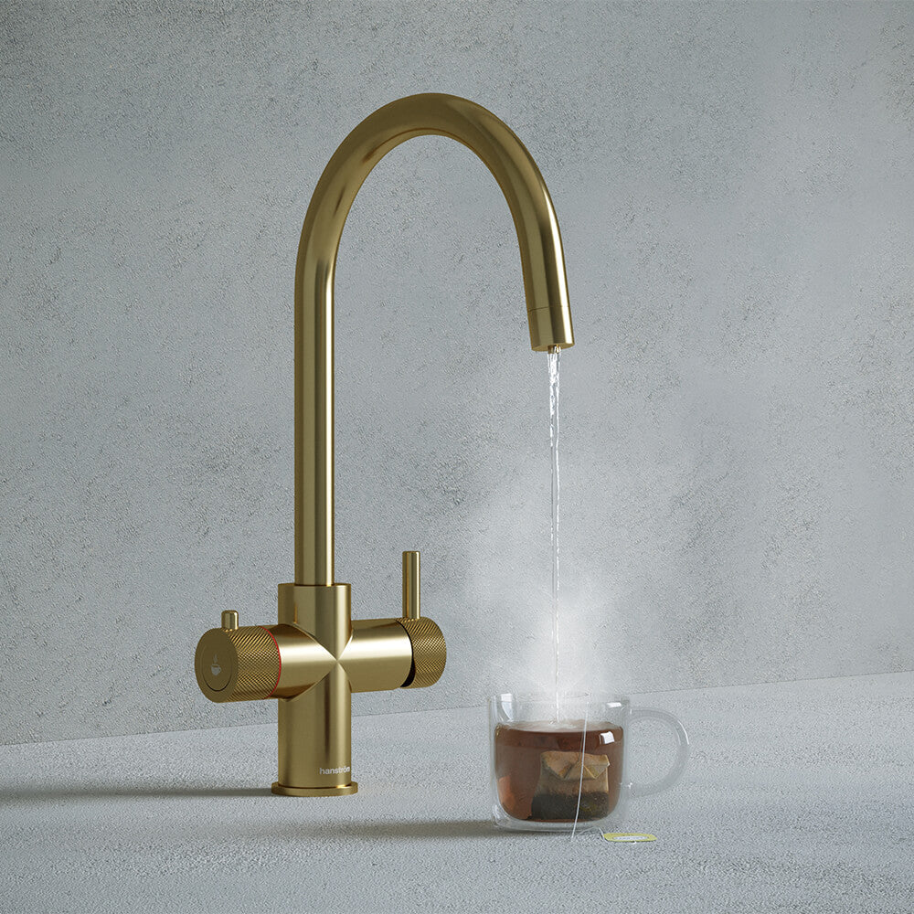 a brushed brass swan neck boiling water tap